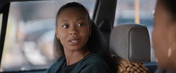 Movie still from “On the Come Up” (2022), directed by Sanaa Lathan – A woman sitting in the back seat of a car; Close Up shot, Over the shoulder angle