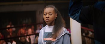 Movie still from “On the Come Up” (2022), directed by Sanaa Lathan – A young woman with long black hair standing in front of a mirror; Close Up shot, Over the shoulder angle