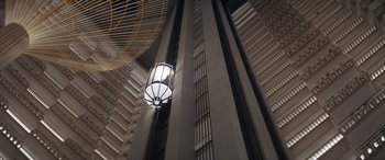 Movie still from “On the Come Up” (2022), directed by Sanaa Lathan – A light hanging from the side of a tall building; Extreme Wide shot, Low angle