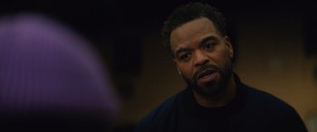 Movie still from “On the Come Up” (2022), directed by Sanaa Lathan – A person wearing a black shirt; Close Up shot, Over the shoulder angle