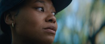 Movie still from “On the Come Up” (2022), directed by Sanaa Lathan – A person wearing a hat; Extreme Close Up shot, Low angle