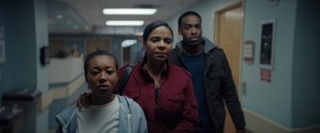Movie still from “On the Come Up” (2022), directed by Sanaa Lathan – A group of people standing next to each other in a hallway; Medium shot, Low angle