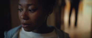 Movie still from “On the Come Up” (2022), directed by Sanaa Lathan – A woman's face with a blurry background; Close Up shot, Over the shoulder angle