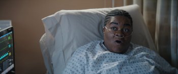 Movie still from “On the Come Up” (2022), directed by Sanaa Lathan – A person in a hospital bed with an open mouth; Close Up shot, High angle