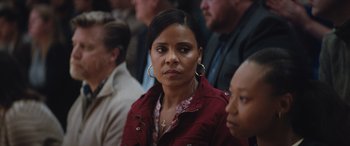 Movie still from “On the Come Up” (2022), directed by Sanaa Lathan – A person sitting in front of a crowd; Close Up shot, Over the shoulder angle