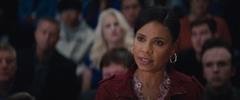 Movie still from “On the Come Up” (2022), directed by Sanaa Lathan – A person wearing a red jacket; Close Up shot, Over the shoulder angle