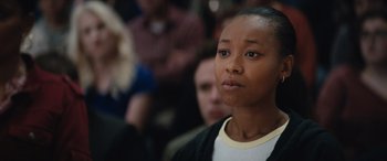 Movie still from “On the Come Up” (2022), directed by Sanaa Lathan – A person sitting in front of a group of people; Close Up shot, Low angle