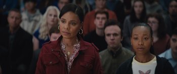 Movie still from “On the Come Up” (2022), directed by Sanaa Lathan – A woman standing in front of a group of people; Close Up shot, Over the shoulder angle