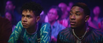 Movie still from “On the Come Up” (2022), directed by Sanaa Lathan – Two men sitting next to each other in front of a crowd of onlookers; Close Up shot, Over the shoulder angle