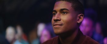 Movie still from “On the Come Up” (2022), directed by Sanaa Lathan – A young man looking up; Close Up shot, Over the shoulder angle
