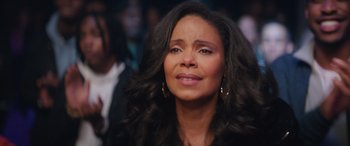 Movie still from “On the Come Up” (2022), directed by Sanaa Lathan – A person with long black hair; Close Up shot, High angle