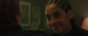 Movie still from “One Ranger” (2023), directed by Jesse V. Johnson – A person smiling; Close Up shot, Over the shoulder angle