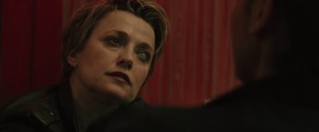 Movie still from “One Ranger” (2023), directed by Jesse V. Johnson – A person looking at the camera; Close Up shot, Over the shoulder angle