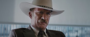 Movie still from “One Ranger” (2023), directed by Jesse V. Johnson – A person wearing a cowboy hat; Close Up shot, Low angle