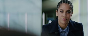 Movie still from “One Ranger” (2023), directed by Jesse V. Johnson – A person wearing a jacket; Close Up shot, Over the shoulder angle