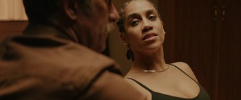 Movie still from “One Ranger” (2023), directed by Jesse V. Johnson – A man and a woman looking at each other in a mirror; Close Up shot, Over the shoulder angle