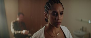 Movie still from “One Ranger” (2023), directed by Jesse V. Johnson – A person wearing a white shirt; Close Up shot, Over the shoulder angle