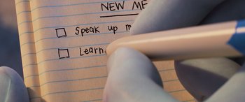 Movie still from “Onward” (2020), directed by Dan Scanlon – A pen is writing on a piece of lined paper; Extreme Close Up shot, Low angle