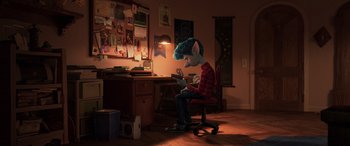 Movie still from “Onward” (2020), directed by Dan Scanlon – A person sitting at a desk in a room; Wide shot, High angle