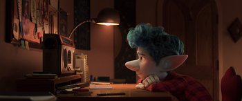 Movie still from “Onward” (2020), directed by Dan Scanlon – An image of an animated character sitting at a desk; Medium shot, Over the shoulder angle