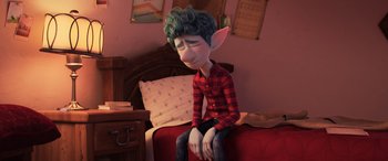 Movie still from “Onward” (2020), directed by Dan Scanlon – An animated character sitting on a bed with his eyes closed; Medium shot, High angle