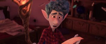 Movie still from “Onward” (2020), directed by Dan Scanlon – An image of an animated character looking at a piece of paper; Medium shot, Over the shoulder angle