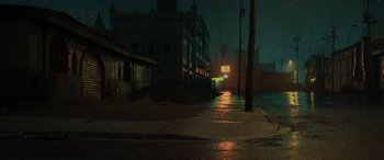 Movie still from “Onward” (2020), directed by Dan Scanlon – A street scene with a street sign and buildings at night time; Extreme Wide shot, High angle