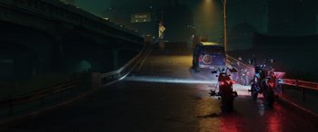 Movie still from “Onward” (2020), directed by Dan Scanlon – A car driving down a street at night with lights on; Extreme Wide shot, High angle