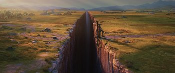 Movie still from “Onward” (2020), directed by Dan Scanlon – An image of an image of a long waterfall in the middle of a field; Extreme Wide shot, Overhead angle