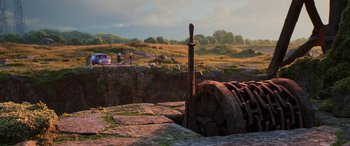 Movie still from “Onward” (2020), directed by Dan Scanlon – An old rusted pipe sitting in the middle of a field; Extreme Wide shot, Low angle