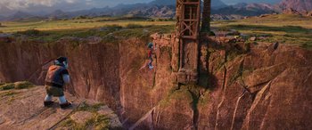 Movie still from “Onward” (2020), directed by Dan Scanlon – A person on a skateboard jumping off of a cliff; Extreme Wide shot, Overhead angle