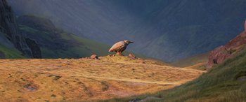 Movie still from “Onward” (2020), directed by Dan Scanlon – A bird standing on top of a grass covered hillside; Extreme Wide shot, Low angle