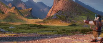 Movie still from “Onward” (2020), directed by Dan Scanlon – A grassy area with mountains in the background; Extreme Wide shot, Low angle