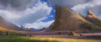 Movie still from “Onward” (2020), directed by Dan Scanlon – People are standing in the grass near a mountain; Extreme Wide shot, Low angle