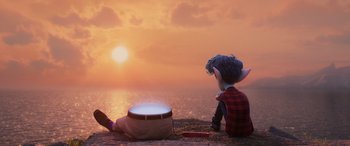 Movie still from “Onward” (2020), directed by Dan Scanlon – An animated character sitting on the ground next to the ocean; Wide shot, High angle