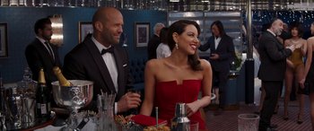 Movie still from “Operation Fortune: Ruse de Guerre” (2023), directed by Guy Ritchie – A man and a woman sitting at a dinner table; Medium shot, Over the shoulder angle