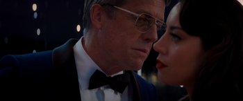 Movie still from “Operation Fortune: Ruse de Guerre” (2023), directed by Guy Ritchie – A person wearing a suit and a bow tie; Close Up shot, Low angle