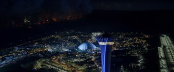 Movie still from “Operation Fortune: Ruse de Guerre” (2023), directed by Guy Ritchie – An aerial view of a city lit up at night; Extreme Wide shot, High angle