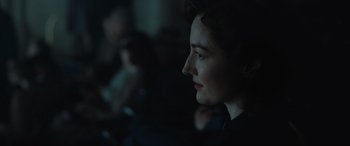 Movie still from “Operation Mincemeat” (2021), directed by John Madden – A person in a dark room; Close Up shot, Over the shoulder angle