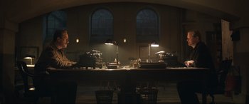 Movie still from “Operation Mincemeat” (2021), directed by John Madden – A room filled with lots of tables and lamps; Extreme Wide shot, Low angle