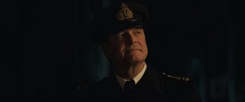 Movie still from “Operation Mincemeat” (2021), directed by John Madden – A person wearing a uniform; Close Up shot, Low angle