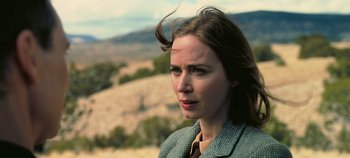 Movie still from “Oppenheimer” (2023), directed by Christopher Nolan – A person wearing a jacket; Close Up shot, Over the shoulder angle