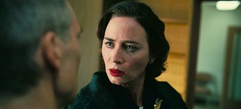 Movie still from “Oppenheimer” (2023), directed by Christopher Nolan – A person wearing a jacket; Close Up shot, Over the shoulder angle