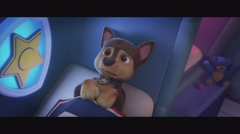 A stuffed dog on a chair