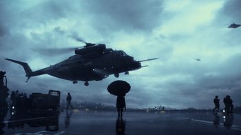 Movie still from “Pacific Rim” (2013), directed by Guillermo del Toro – A person holding an umbrella while standing in front of an airplane; Extreme Wide shot, Low angle