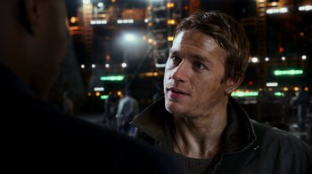 Movie still from “Pacific Rim” (2013), directed by Guillermo del Toro – A person looking at the camera; Close Up shot, Over the shoulder angle