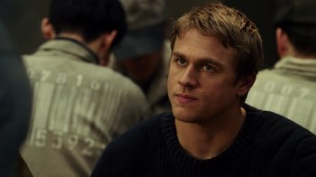 Movie still from “Pacific Rim” (2013), directed by Guillermo del Toro – A person wearing a sweater; Close Up shot, Over the shoulder angle