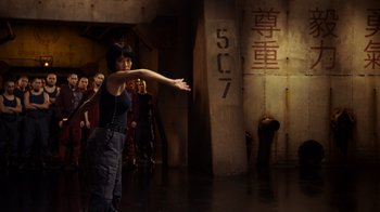 Movie still from “Pacific Rim” (2013), directed by Guillermo del Toro – A group of people standing in a room; Medium shot, Over the shoulder angle