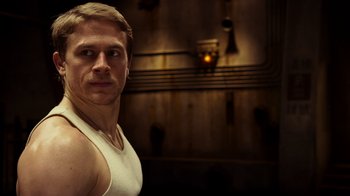 Movie still from “Pacific Rim” (2013), directed by Guillermo del Toro – A person wearing a tank top; Close Up shot, Low angle