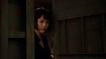 Movie still from “Pacific Rim” (2013), directed by Guillermo del Toro – A woman standing in front of an open door; Close Up shot, Over the shoulder angle